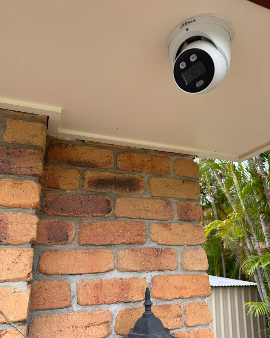 Turret camera on brick pillar exterior