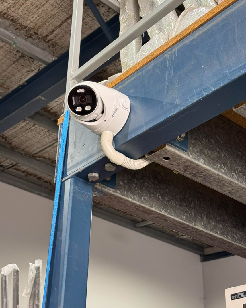CCTV camera on warehouse steel beam